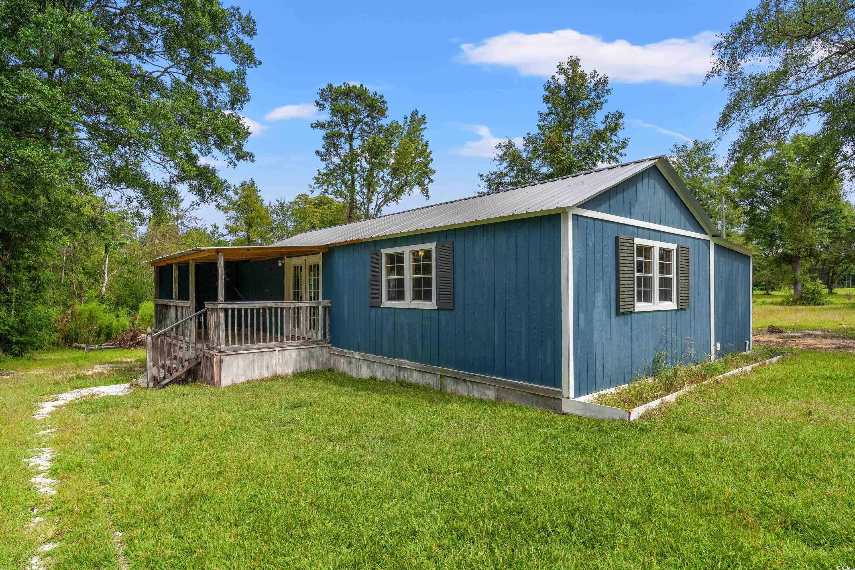 476 Live Oak Church Road Loris, SC 29569 - Photo 23 of 39 Exterior space with a front yard
