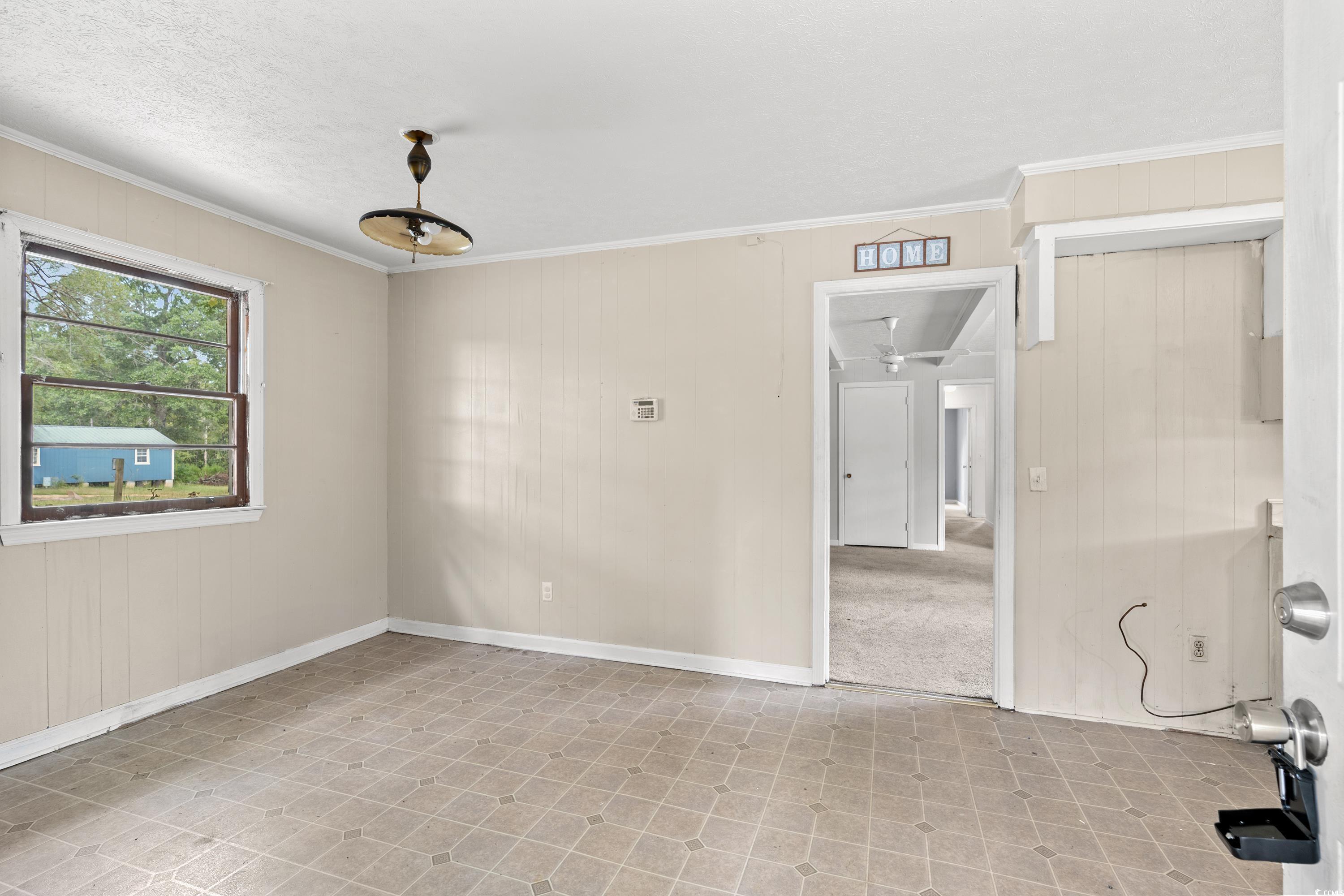 476 Live Oak Church Road Loris, SC 29569 - Photo 3 of 39 Spare room with a textured ceiling, ornamental mol