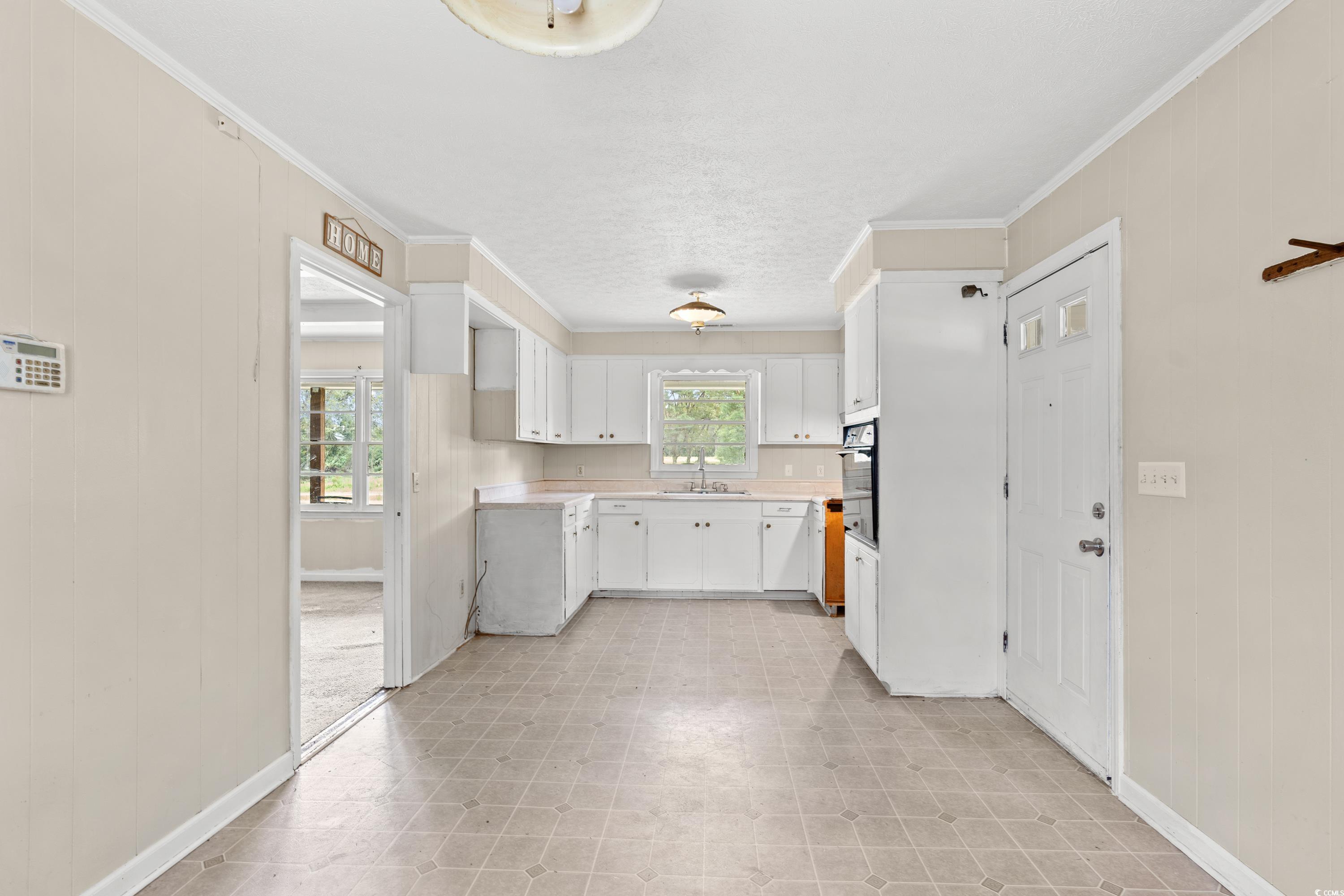 476 Live Oak Church Road Loris, SC 29569 - Photo 4 of 39 Kitchen with ornamental molding, a textured ceilin