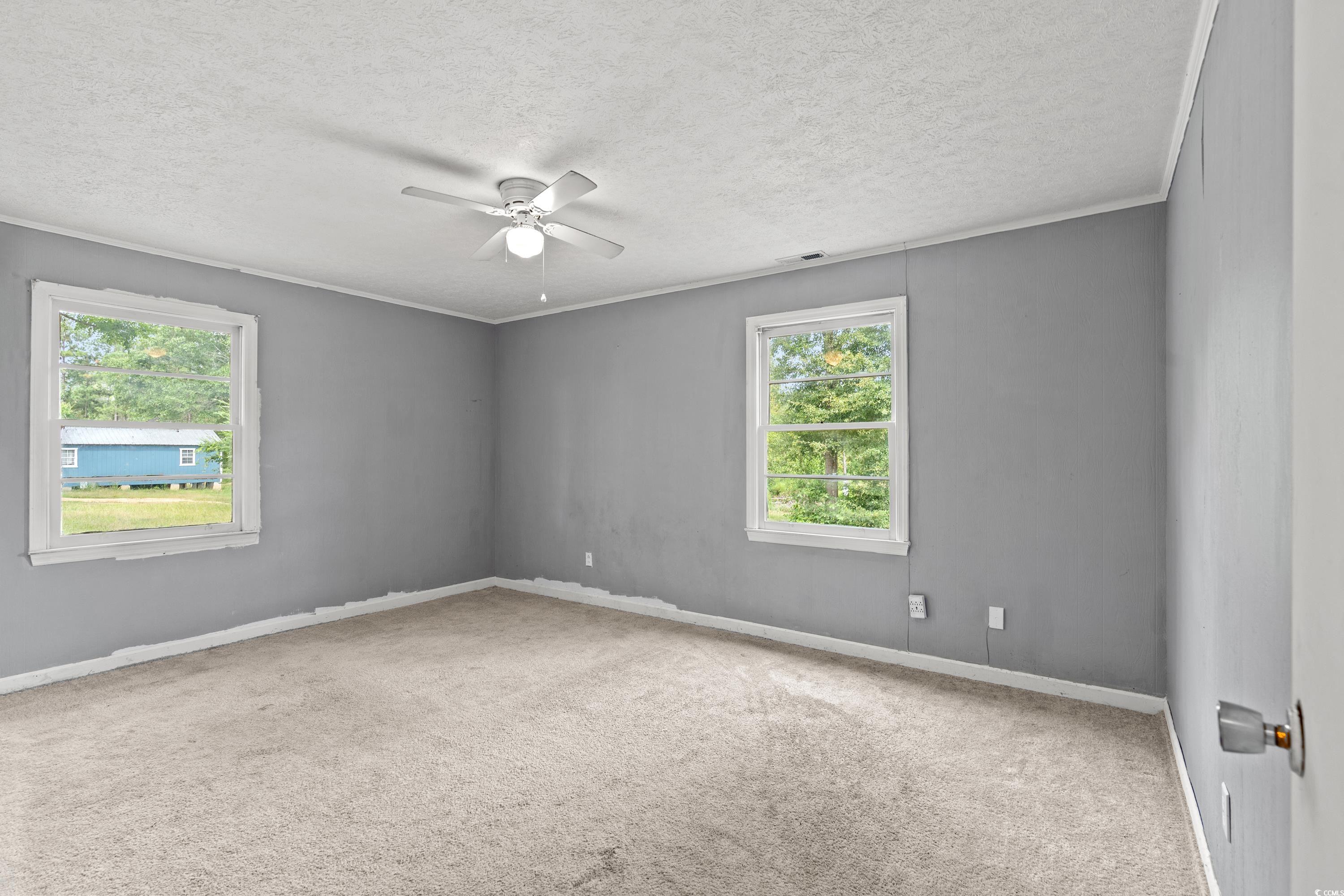 476 Live Oak Church Road Loris, SC 29569 - Photo 9 of 39 Unfurnished room with a textured ceiling, carpet f