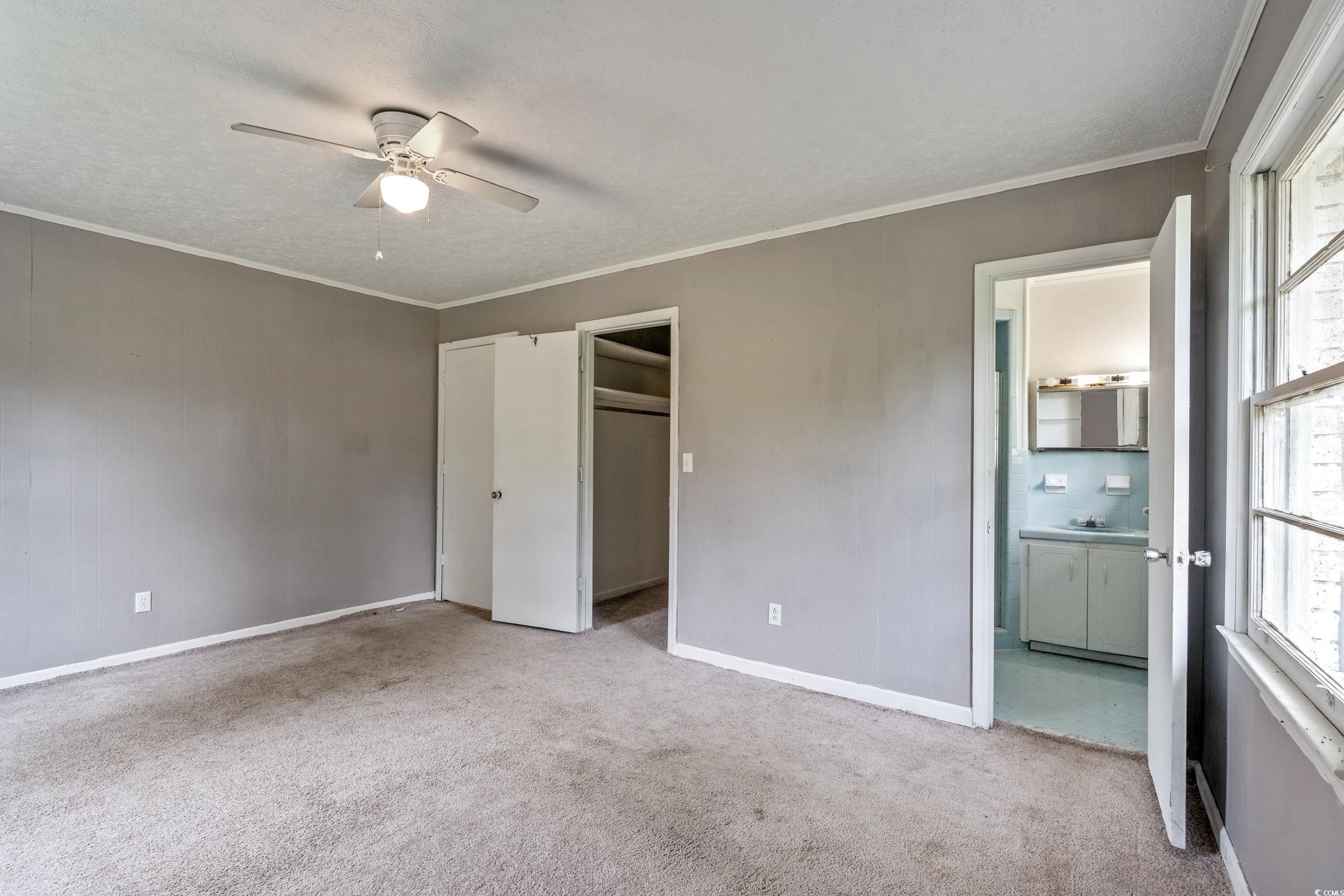 476 Live Oak Church Road Loris, SC 29569 - Photo 10 of 39 Unfurnished bedroom with a textured ceiling, light