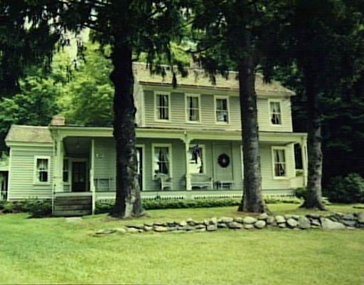 70 Hawleyville Road Newtown, CT 06470 - Photo 1 of 1 a front view of a house with a yard