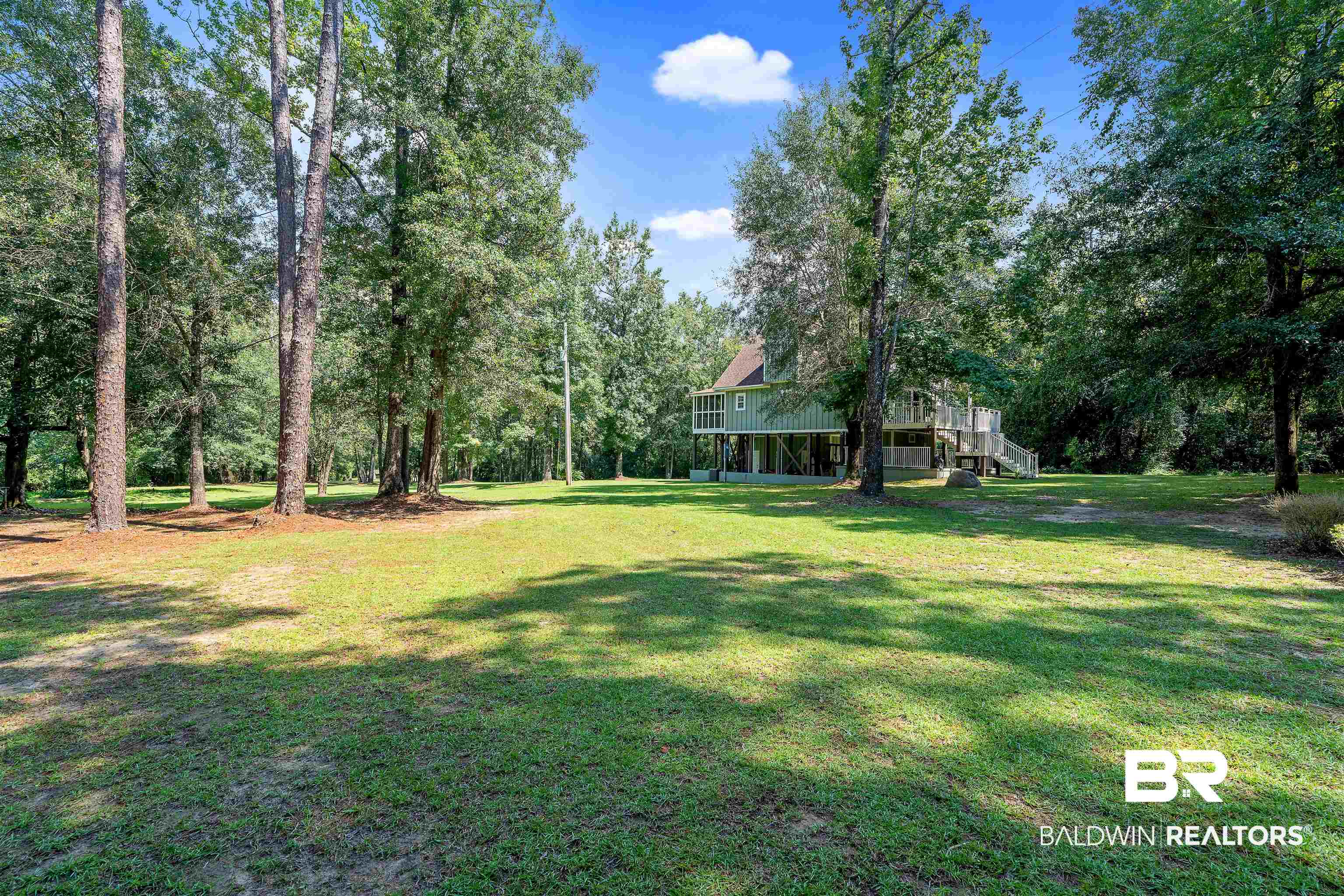 25591 Waterworld Road Robertsdale, AL 36567 - Photo 10 of 33 View of yard with a wooden deck