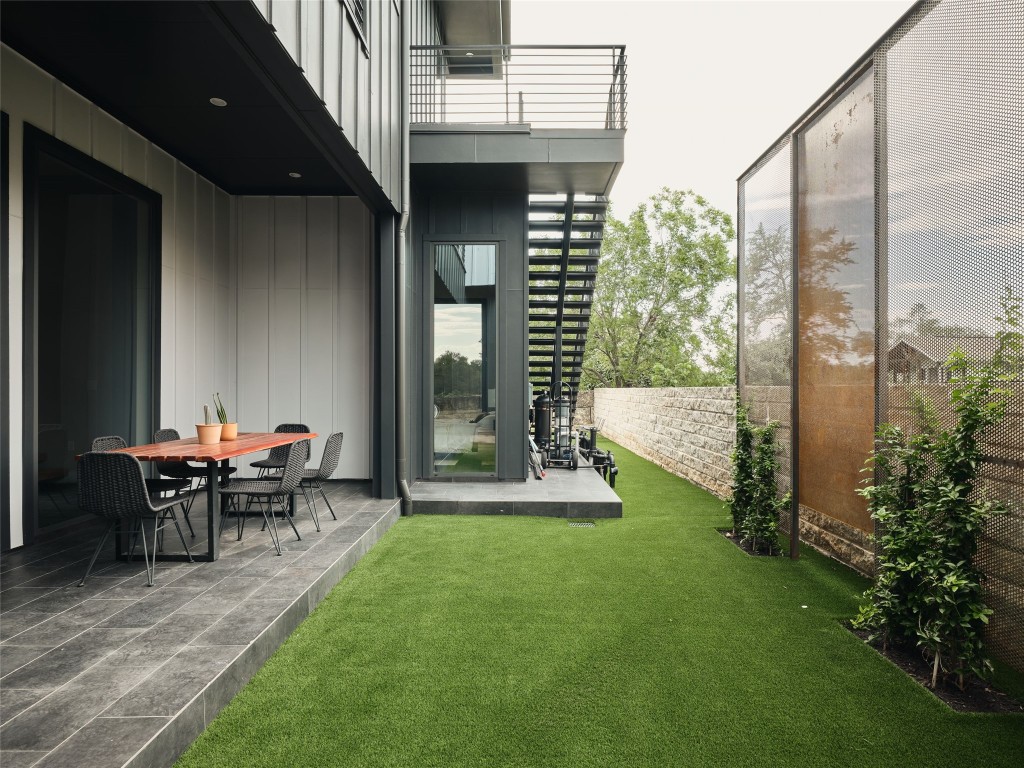 412 Kemp Street Austin, TX 78741 - Photo 15 of 37 Fenced backyard featuring a balcony and a patio area