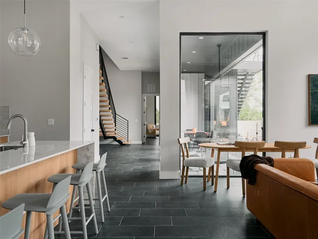 a bedroom with a large bed and a large window