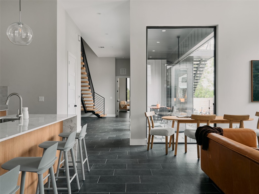 412 Kemp Street Austin, TX 78741 - Photo 16 of 37 Dining room featuring stairs and recessed lighting