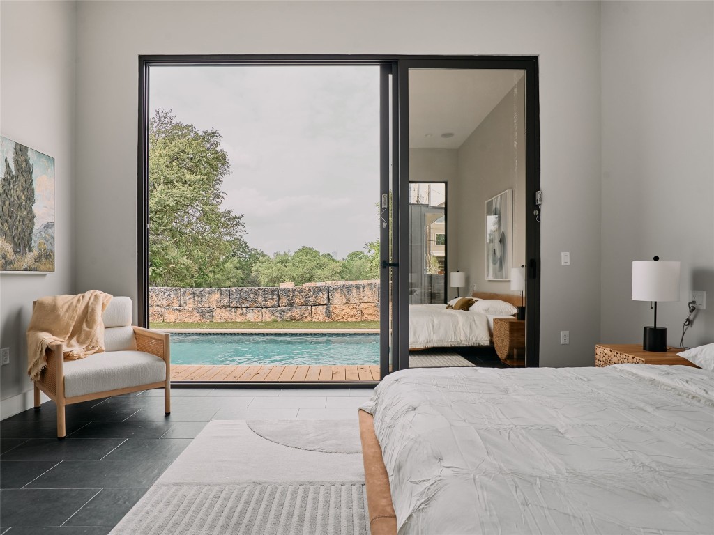 412 Kemp Street Austin, TX 78741 - Photo 18 of 37 Bedroom with access to outside