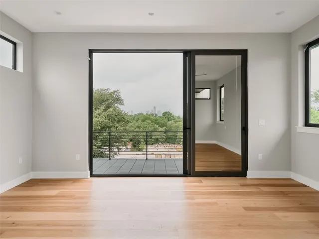 a view of a balcony with wooden floor