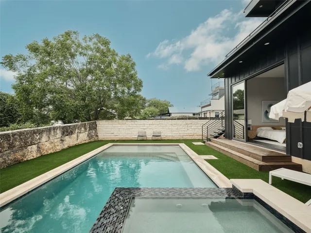 a view of a porch with chairs and backyard