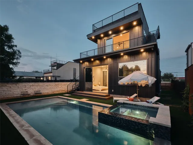 a view of a yard with swimming pool