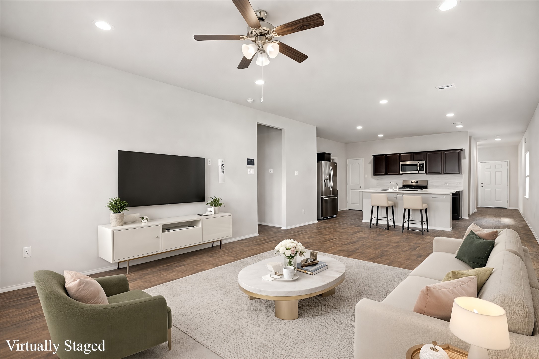 23119 Rivercane Shadow Trail Spring, TX 77373 - Photo 2 of 29 a living room with furniture and a flat screen tv