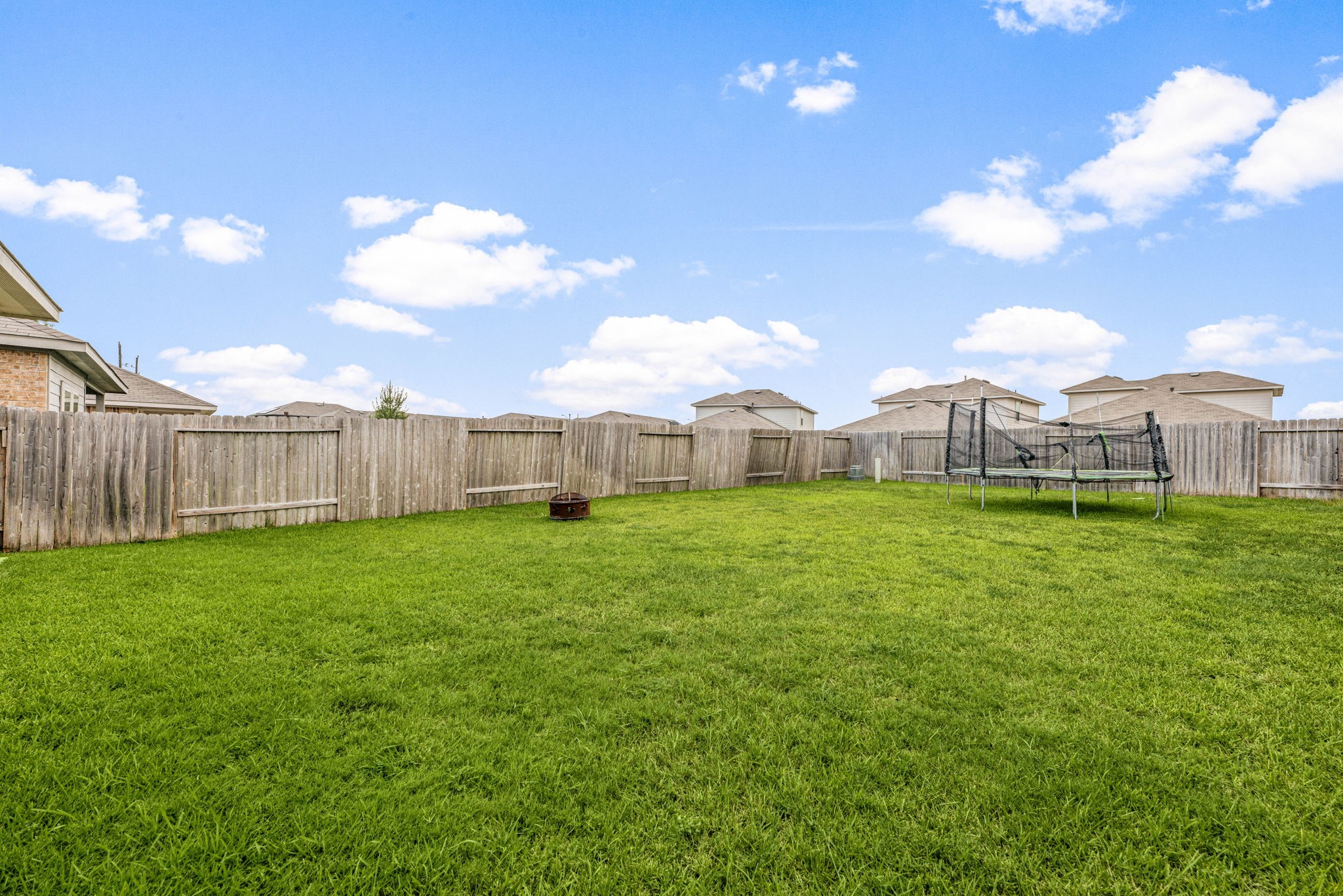 23119 Rivercane Shadow Trail Spring, TX 77373 - Photo 22 of 29 a view of a house with backyard and a garden
