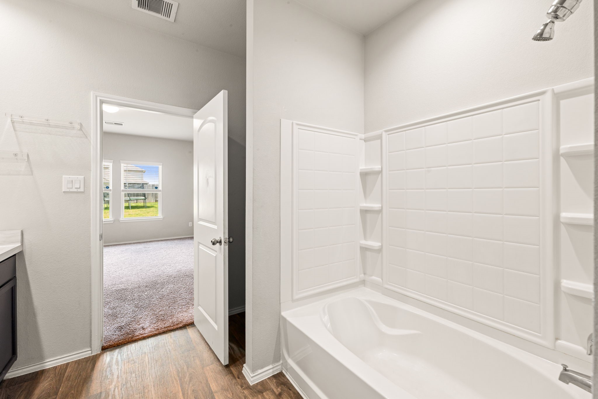 23119 Rivercane Shadow Trail Spring, TX 77373 - Photo 9 of 29 a bathroom with a bathtub
