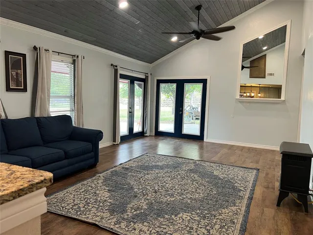 a living room with furniture and a rug