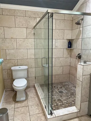 a view of room with window and wooden floor