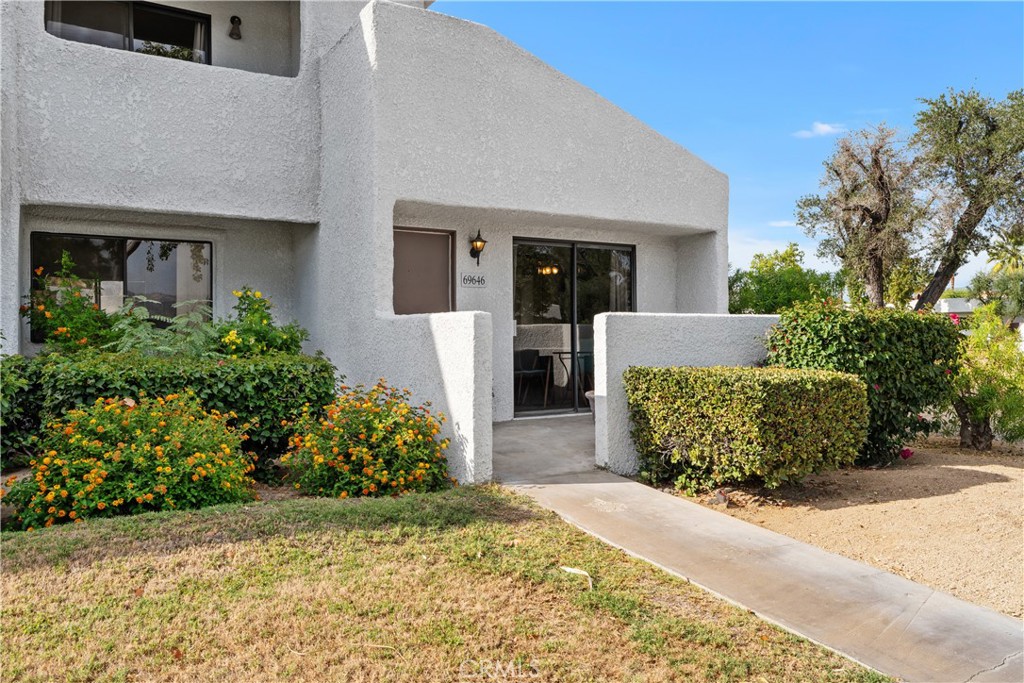 69646 Antonia Way Rancho Mirage, CA 92270 - Photo 10 of 50 a front view of a house with garden