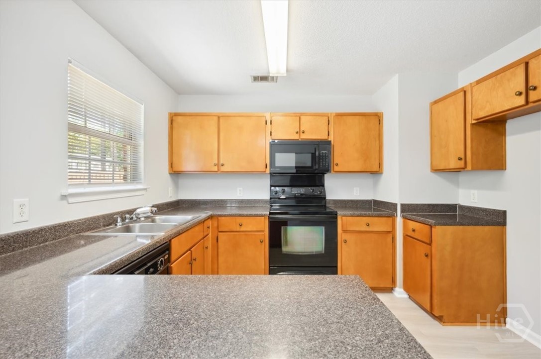 24 Stalwick Drive Pooler, GA 31322 - Photo 7 of 34 Love the window over the kitchen sink.