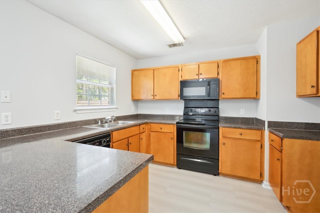 24 Stalwick Drive Pooler, GA 31322 - Photo 8 of 34 Have a view of the back yard from the kitchen sink
