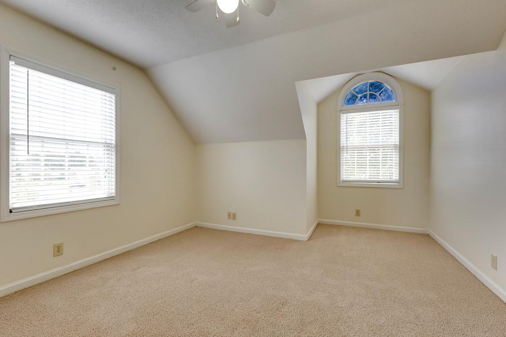 3636 Mahlon Moore Road Spring Hill, TN 37174 - Photo 17 of 22 an empty room with a window and a ceiling fan