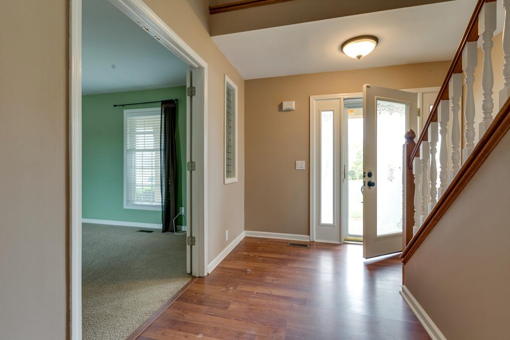3636 Mahlon Moore Road Spring Hill, TN 37174 - Photo 3 of 22 a view of a hallway with wooden floor