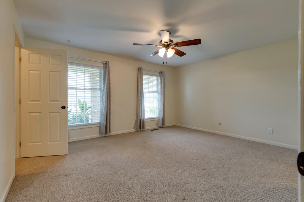 3636 Mahlon Moore Road Spring Hill, TN 37174 - Photo 10 of 22 an empty room with windows and fan