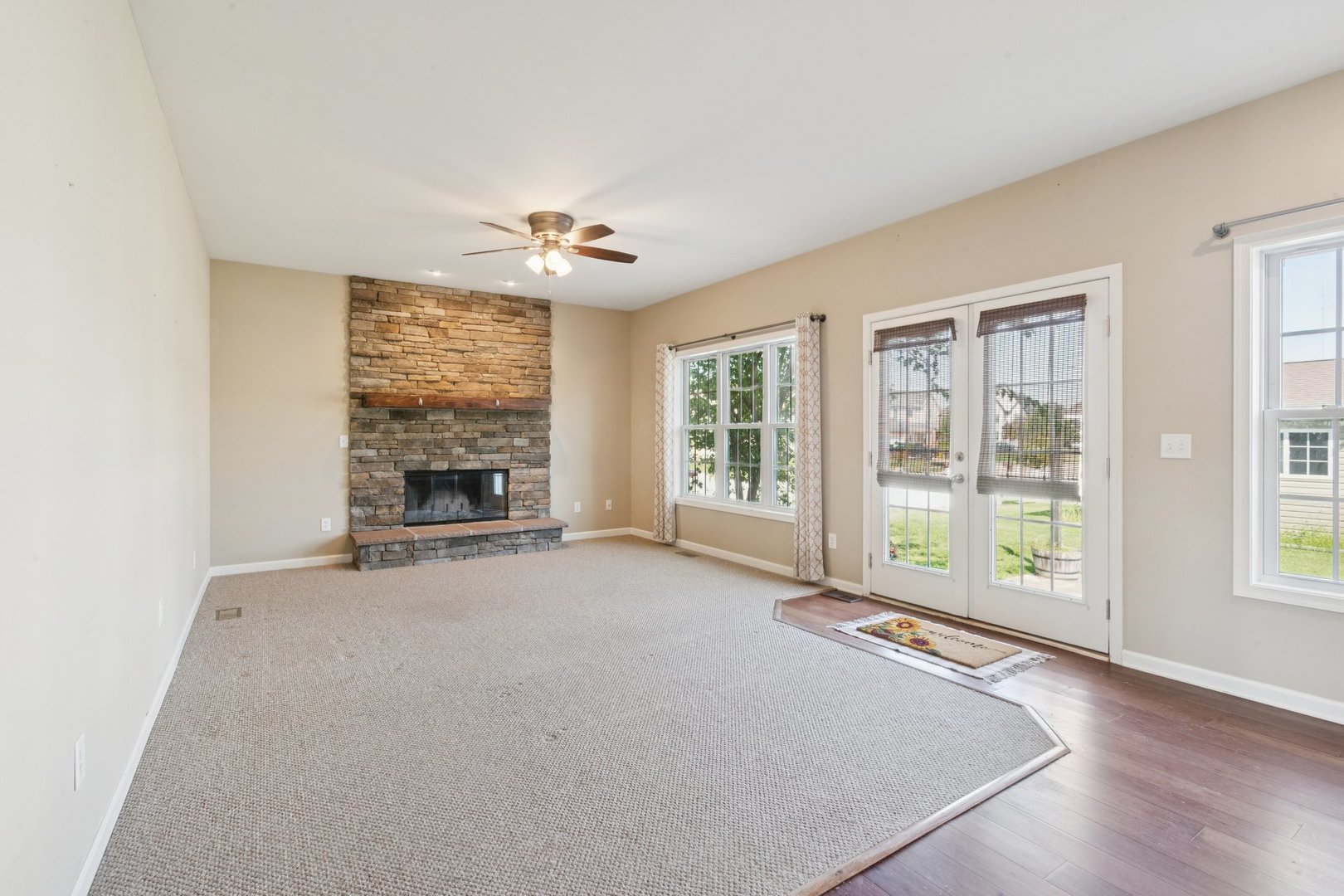 345 South Calkey Street Diamond, IL 60416 - Photo 16 of 50 an empty room with windows and fireplace