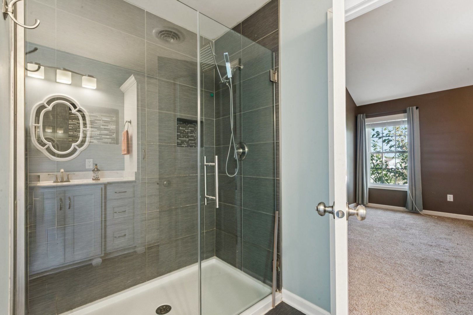 345 South Calkey Street Diamond, IL 60416 - Photo 26 of 50 a bathroom with a sink a mirror and a shower