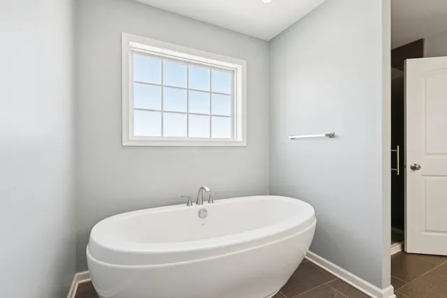a white bath tub sitting in a bathroom
