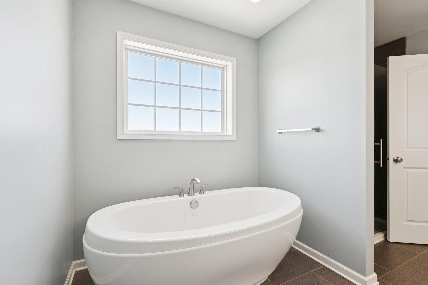 345 South Calkey Street Diamond, IL 60416 - Photo 27 of 50 a white bath tub sitting in a bathroom