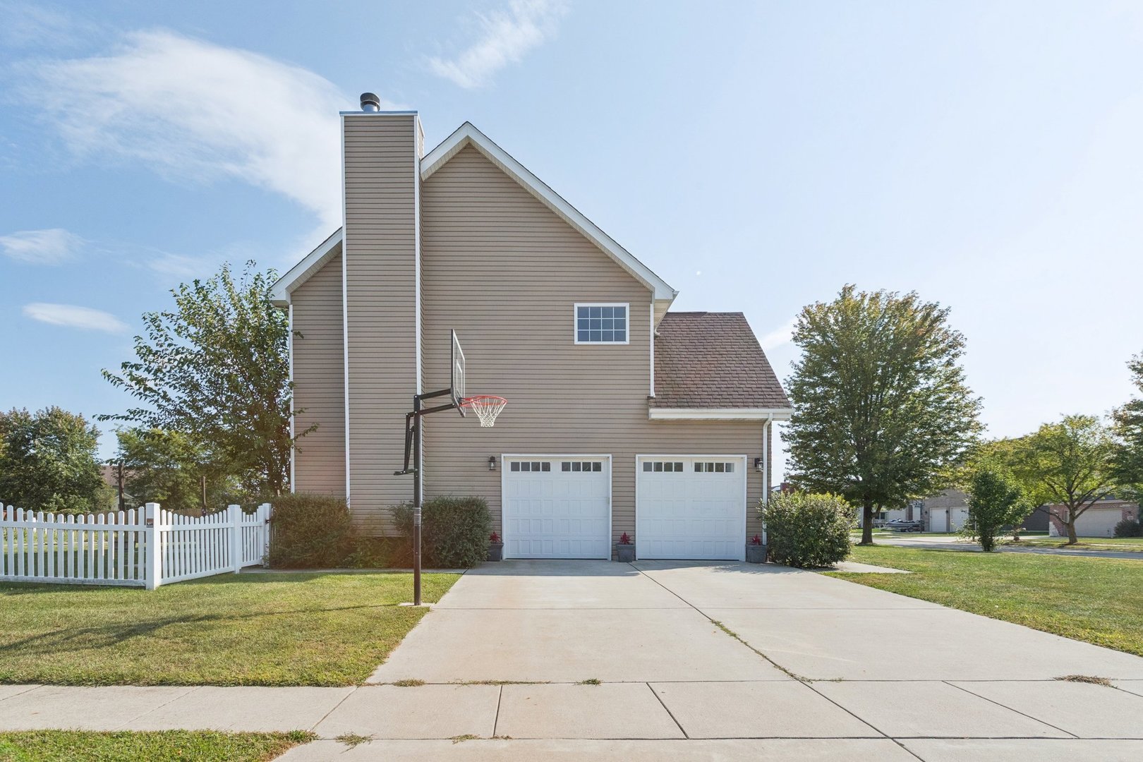 345 South Calkey Street Diamond, IL 60416 - Photo 4 of 50 a front view of a house with a yard and garage
