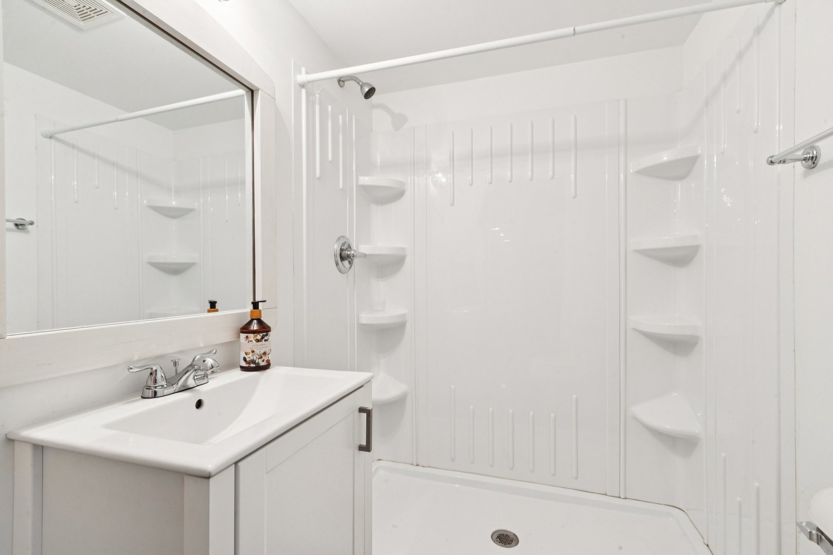 345 South Calkey Street Diamond, IL 60416 - Photo 42 of 50 a bathroom with a sink a shower and a mirror