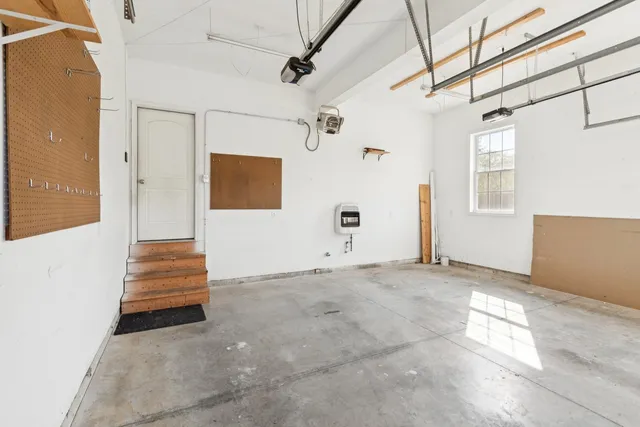 a view of room with stairs and wooden floor