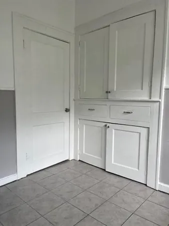 a view of white cabinet and cabinet