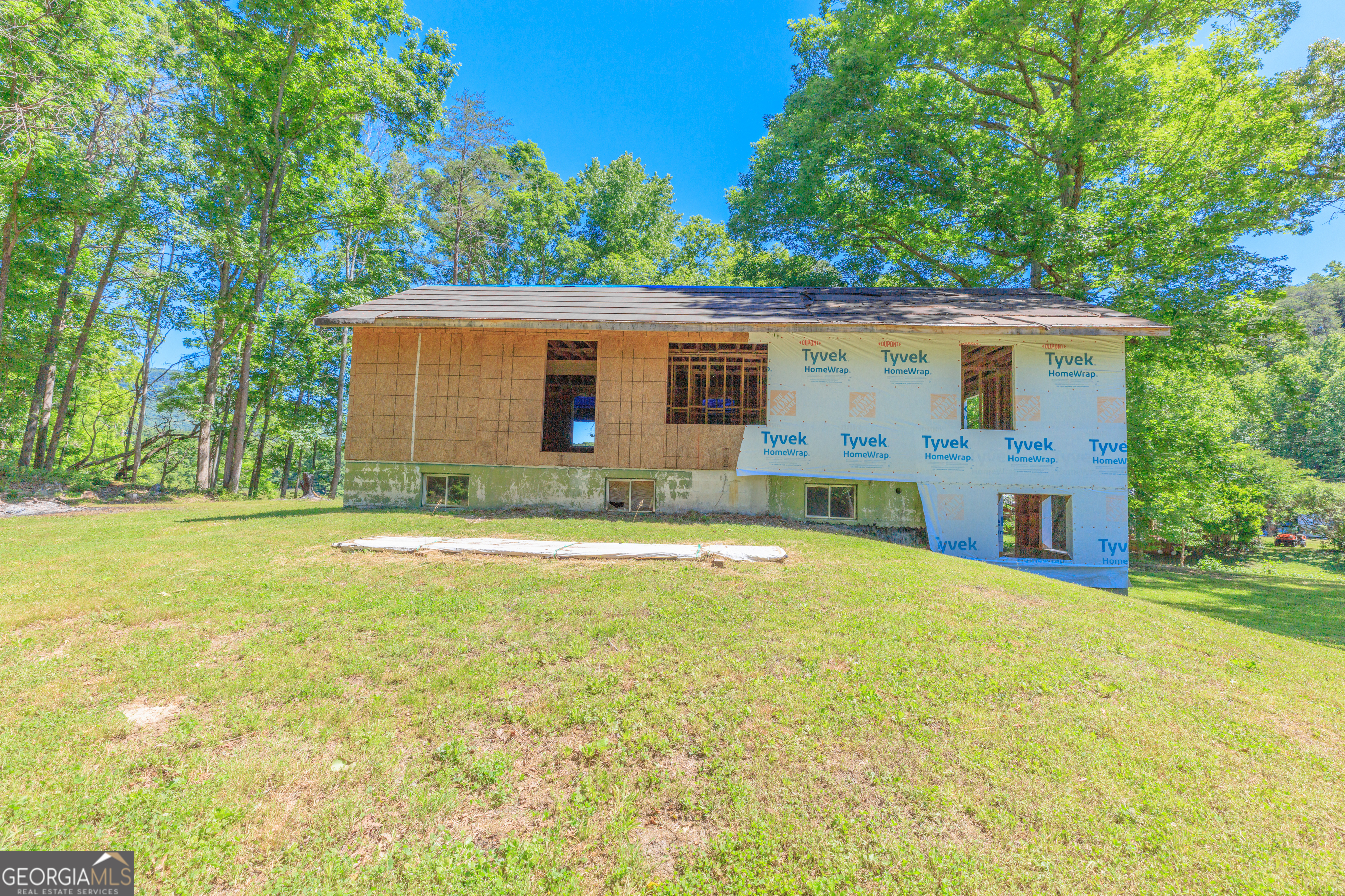 1004 Crow Gap Road Chickamauga, GA 30707 - Photo 4 of 36 a view of a house with pool and a yard