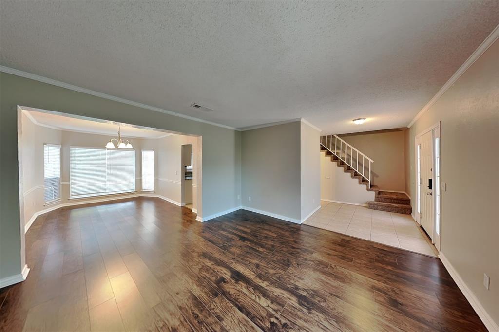 604 Ashby Place Allen, TX 75002 - Photo 2 of 21 a view of empty room with wooden floor and fan