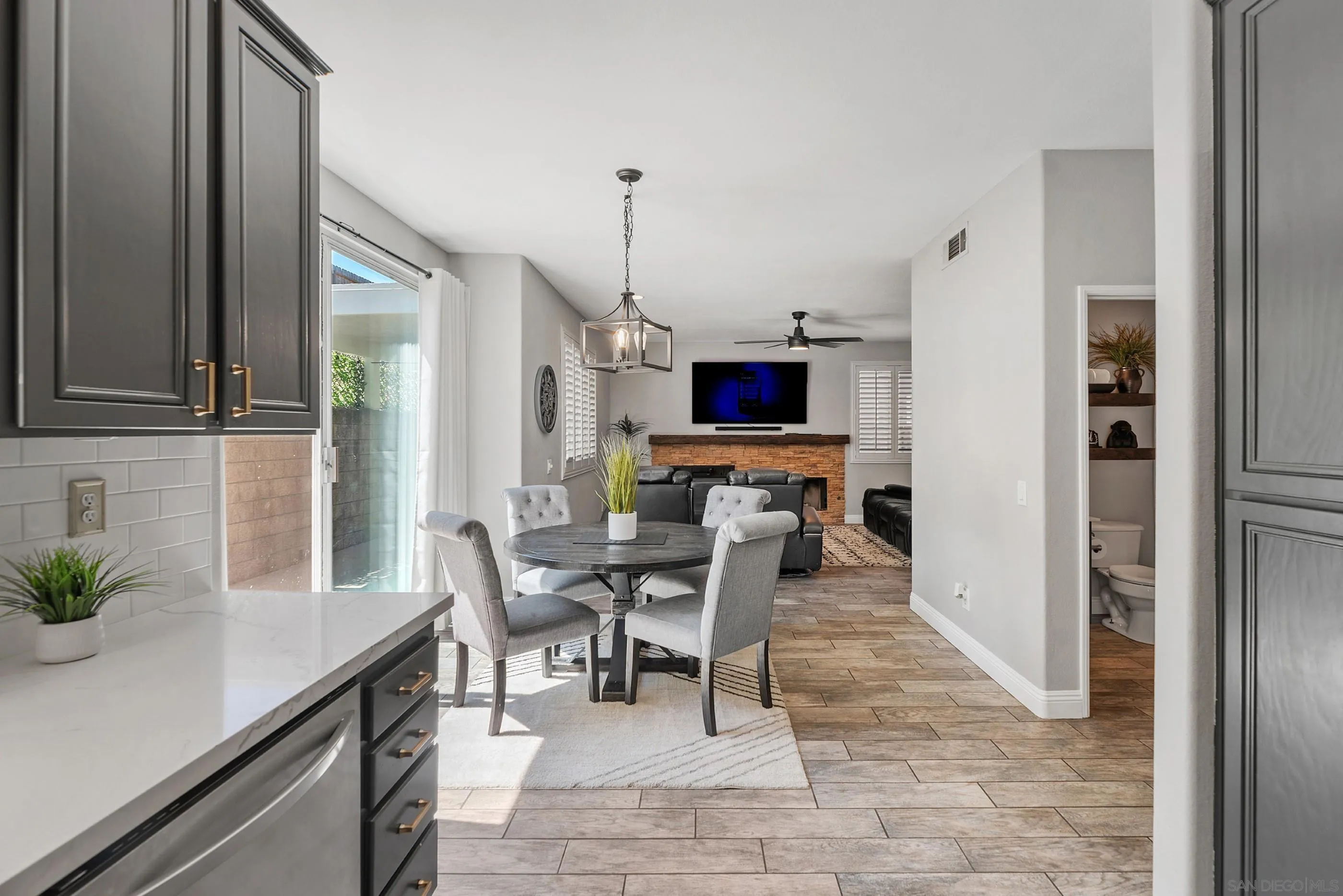 2969 River Dance Way Alpine, CA 91901 - Photo 13 of 40 a living room with furniture a dining table and a potted plant