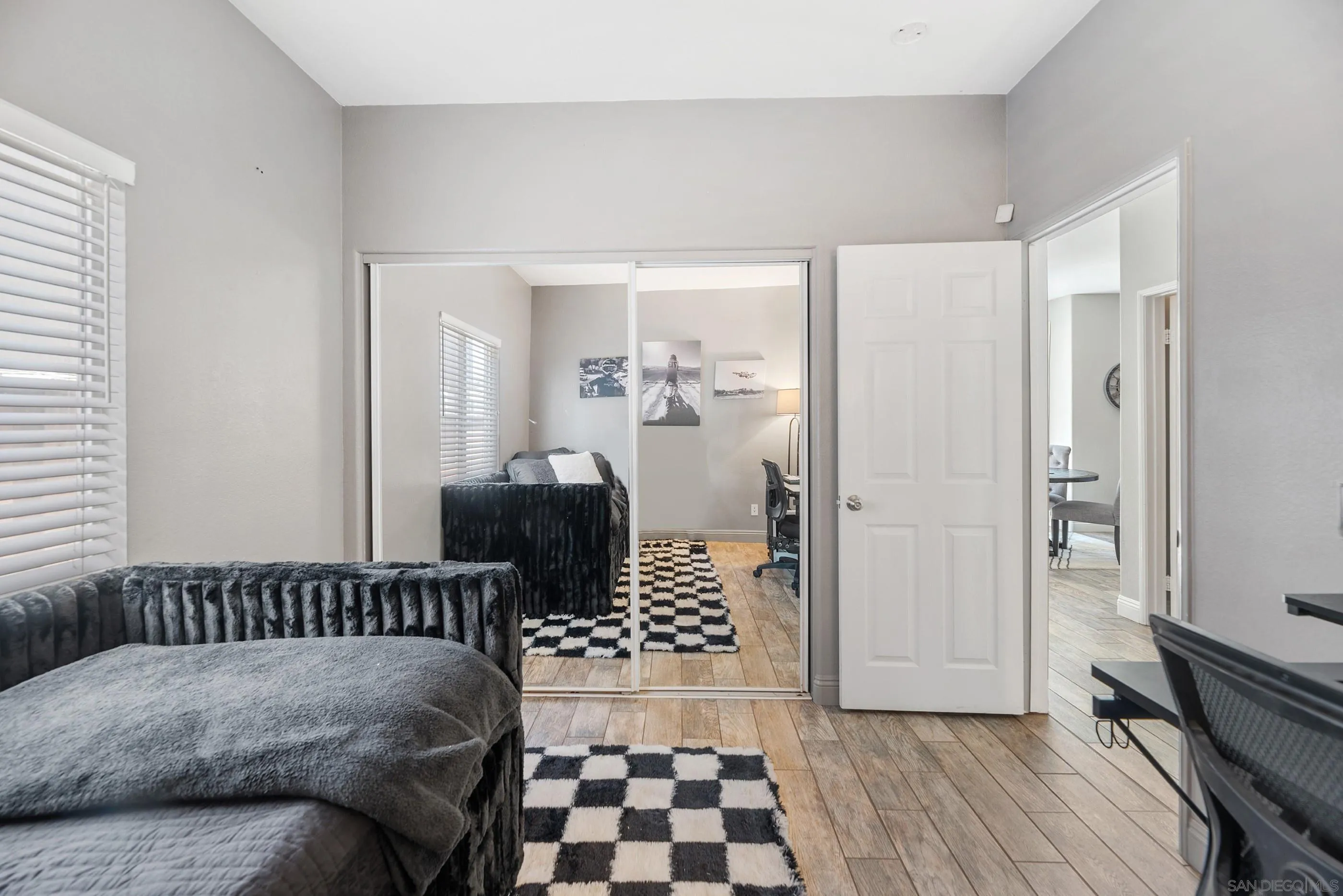 2969 River Dance Way Alpine, CA 91901 - Photo 18 of 40 a bedroom with a bed and wooden floor