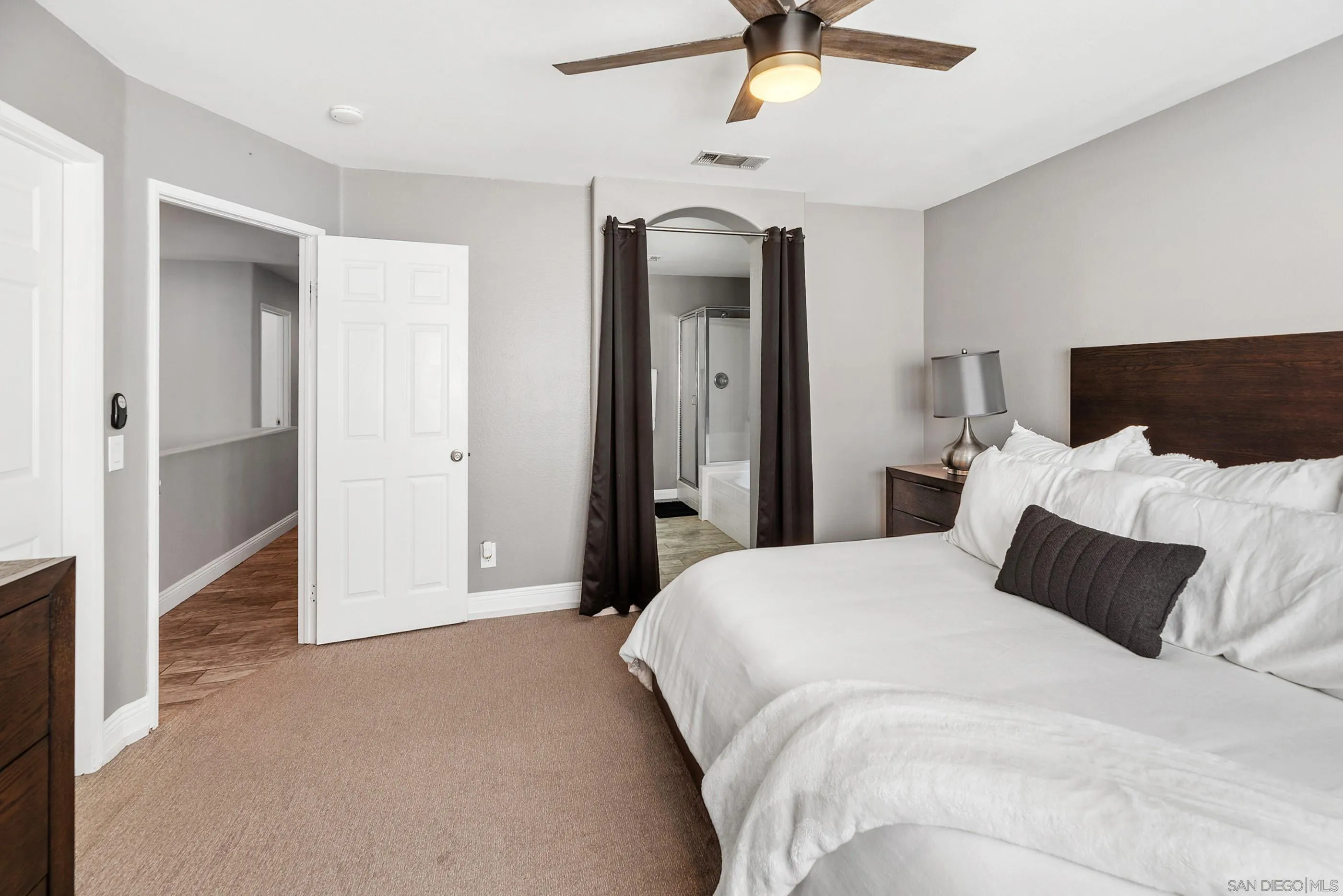 2969 River Dance Way Alpine, CA 91901 - Photo 27 of 40 a bedroom with bed and ceiling fan