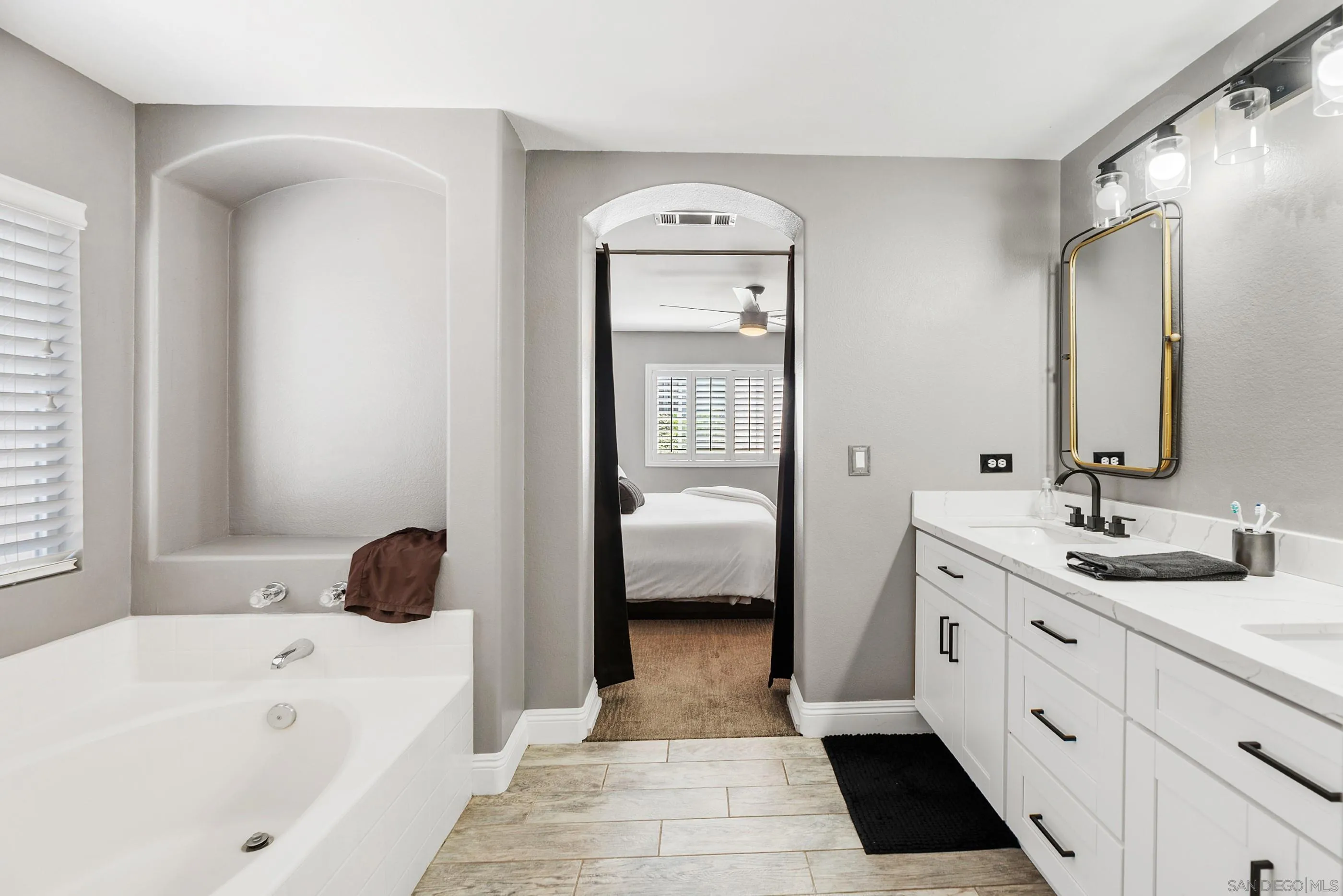 2969 River Dance Way Alpine, CA 91901 - Photo 29 of 40 a en suite spacious bathroom with a tub sink and mirror