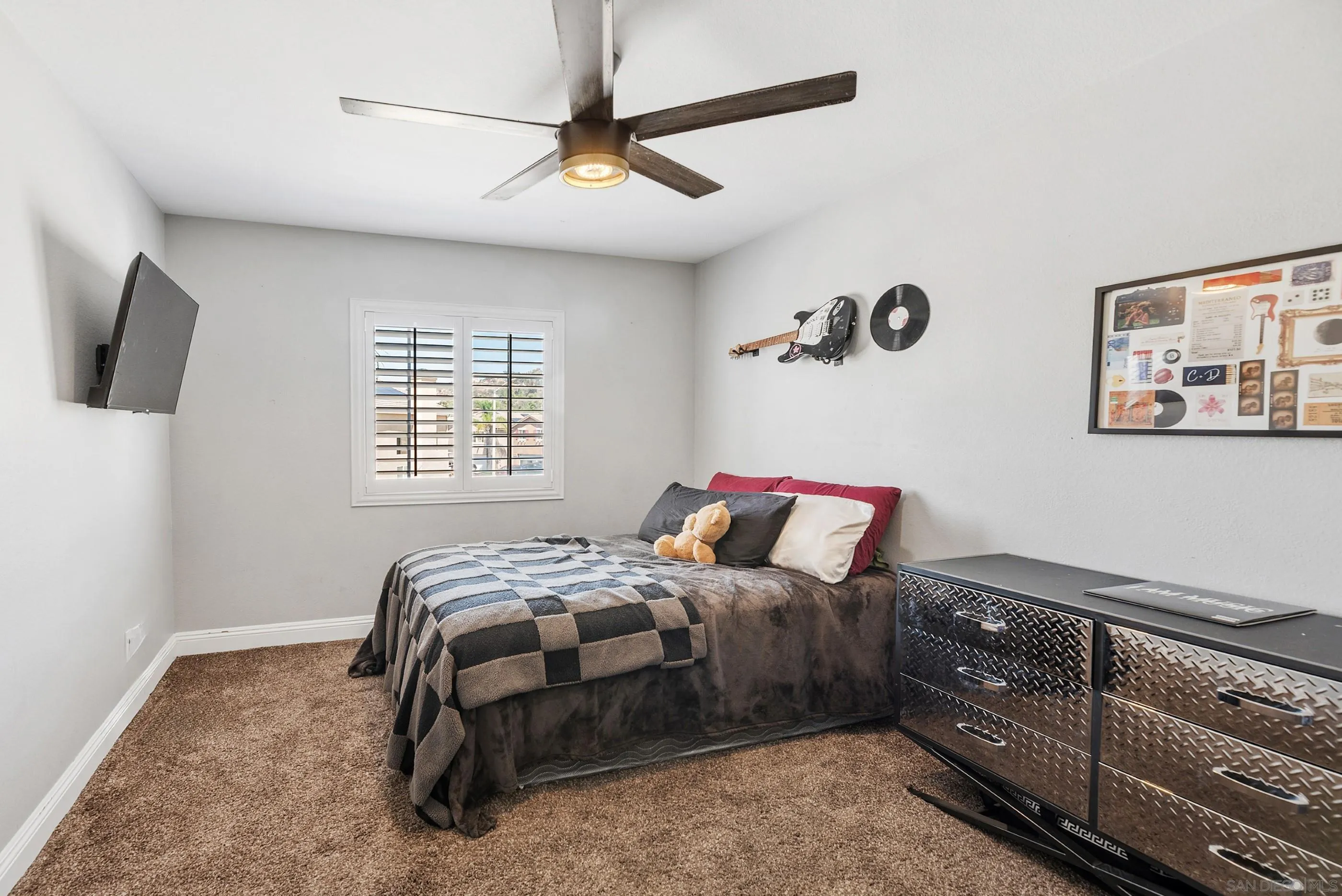 2969 River Dance Way Alpine, CA 91901 - Photo 33 of 40 a bedroom with a bed and flat screen tv