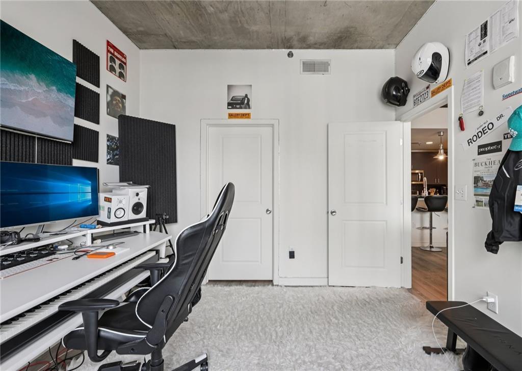 250 Pharr Road Northeast, Unit 1005 Atlanta, GA 30305 - Photo 15 of 25 a view of a workspace with furniture