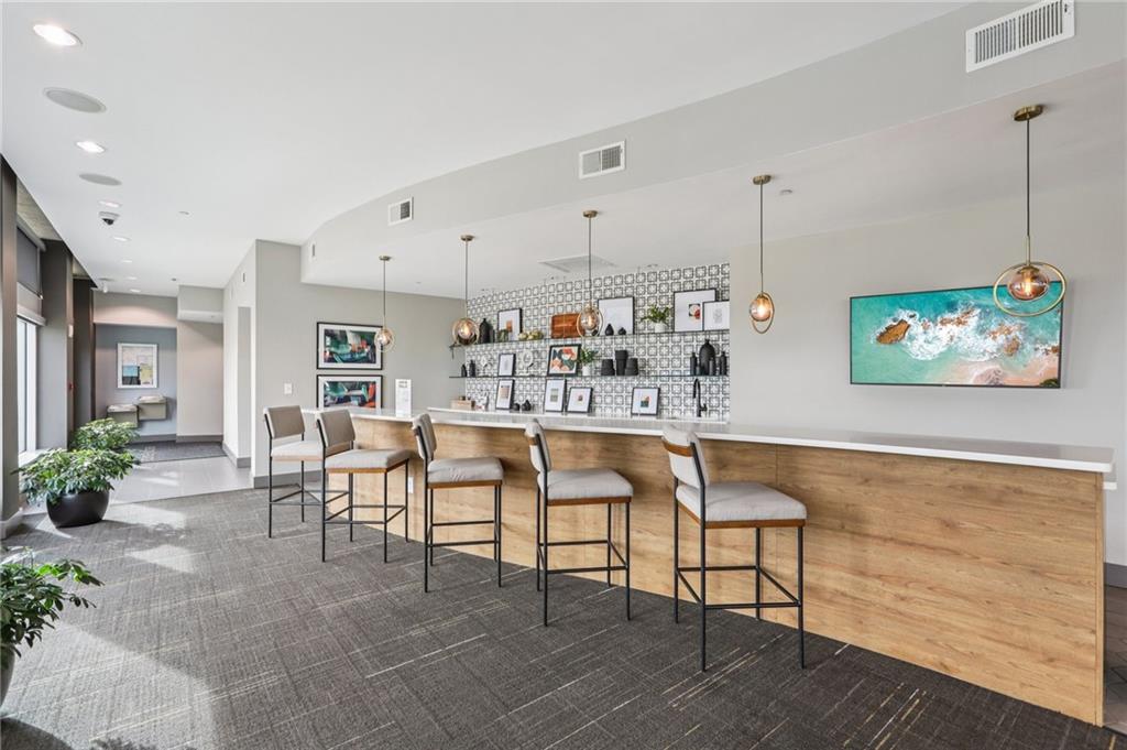 250 Pharr Road Northeast, Unit 1005 Atlanta, GA 30305 - Photo 22 of 25 a view of a dining room with furniture