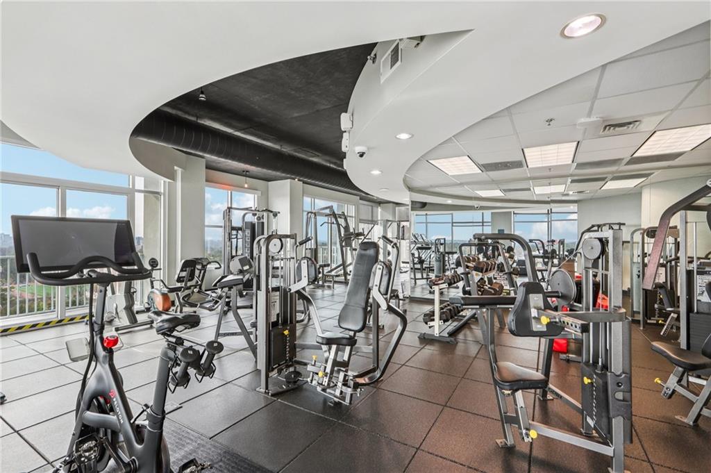 250 Pharr Road Northeast, Unit 1005 Atlanta, GA 30305 - Photo 23 of 25 a view of a room with gym equipment