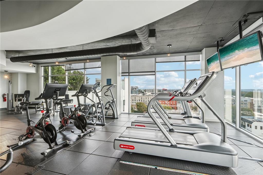 250 Pharr Road Northeast, Unit 1005 Atlanta, GA 30305 - Photo 24 of 25 a view of a room with gym equipment