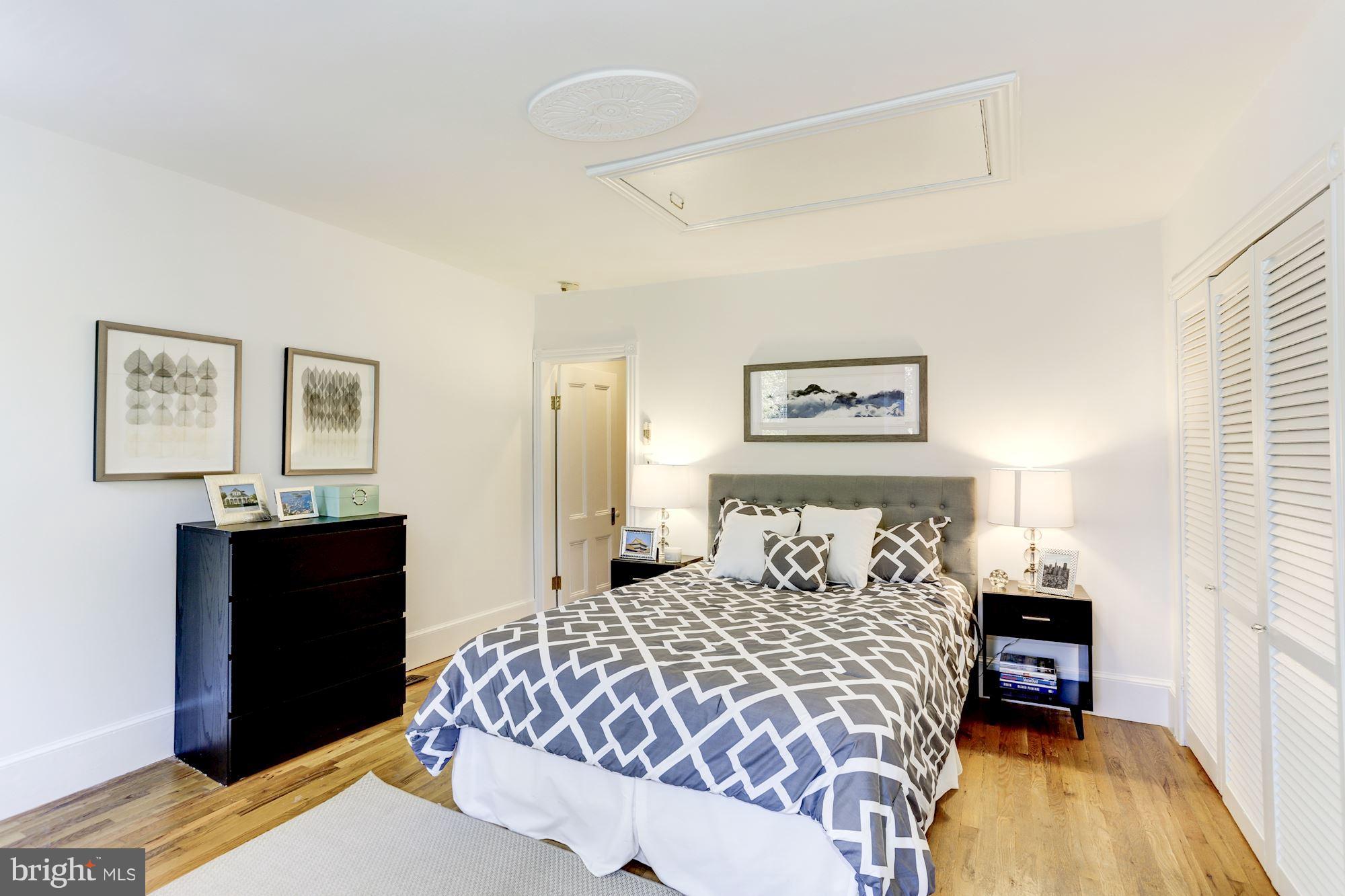 425 5th Street Northeast Washington, DC 20002 - Photo 14 of 21 a bedroom with a bed and wooden floor