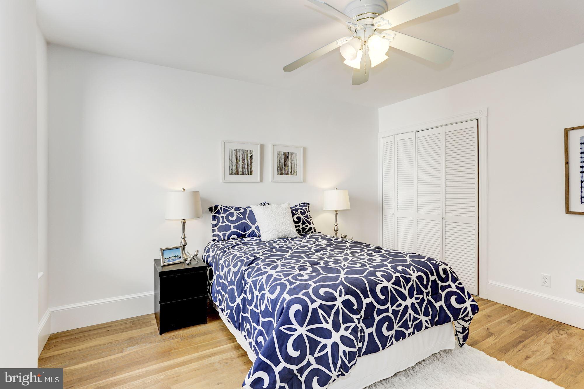 425 5th Street Northeast Washington, DC 20002 - Photo 17 of 21 a bedroom with a bed and a chandelier