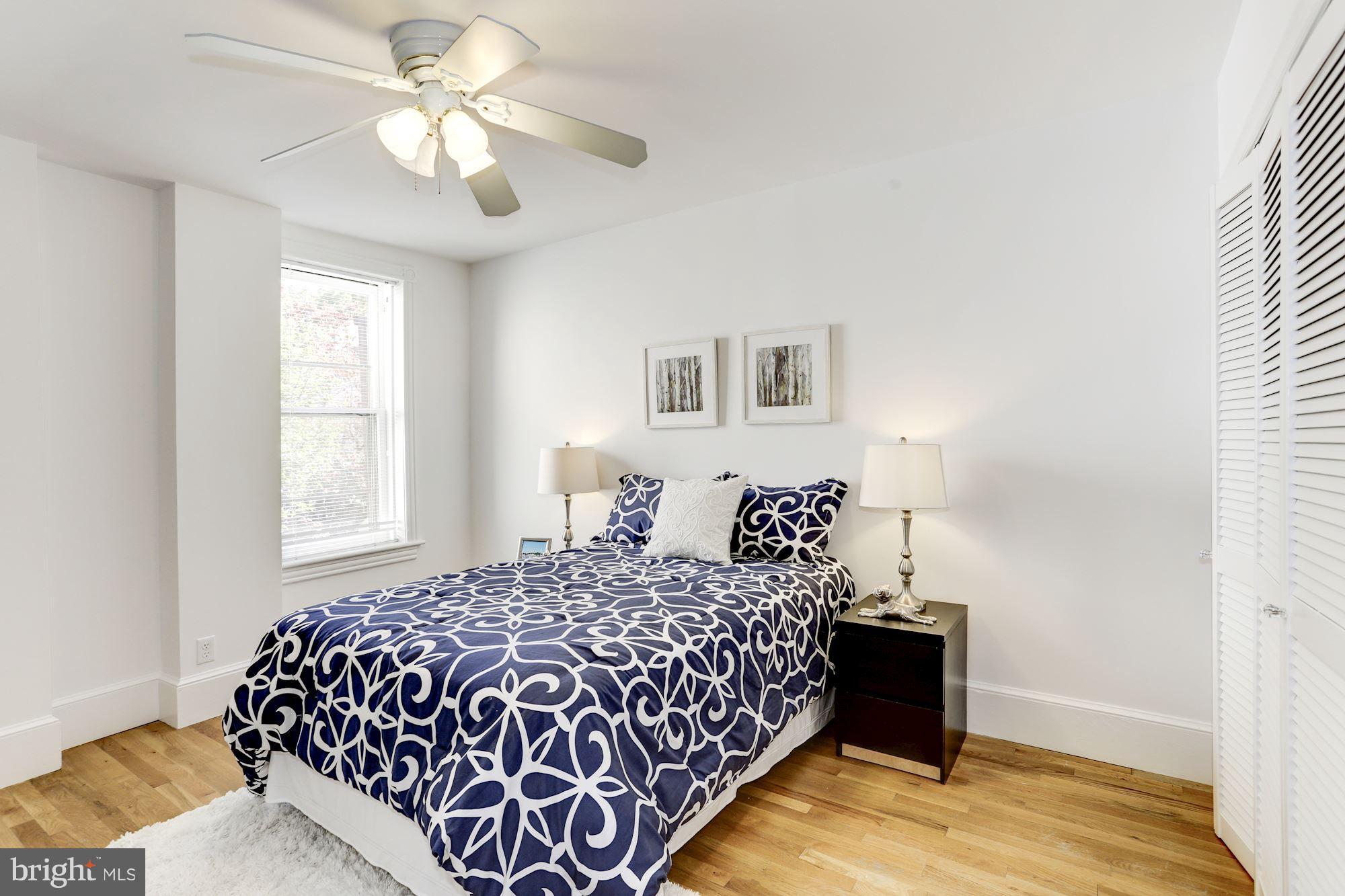 425 5th Street Northeast Washington, DC 20002 - Photo 18 of 21 a bedroom with a bed and a window