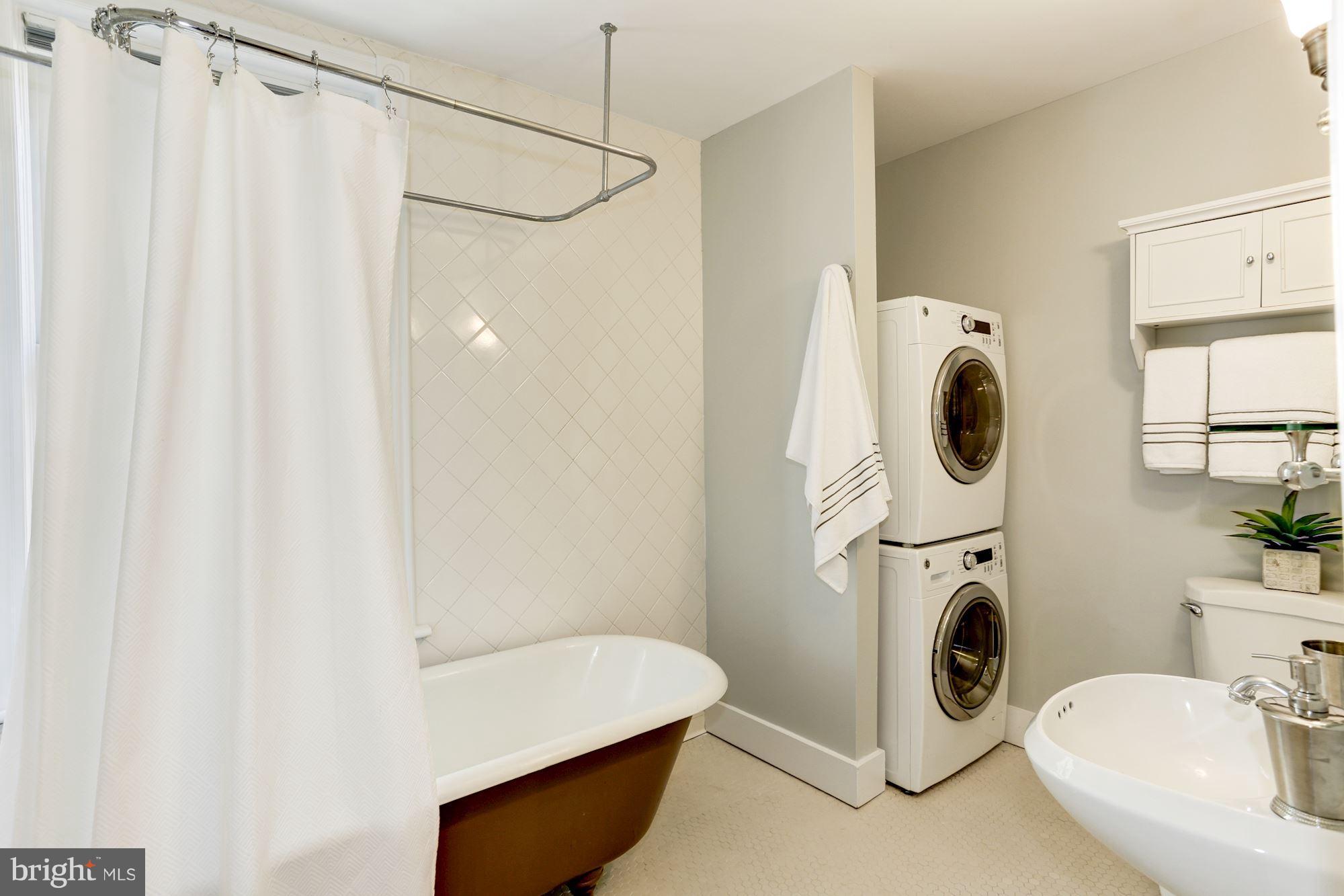 425 5th Street Northeast Washington, DC 20002 - Photo 19 of 21 a bathroom with a sink a washer and dryer