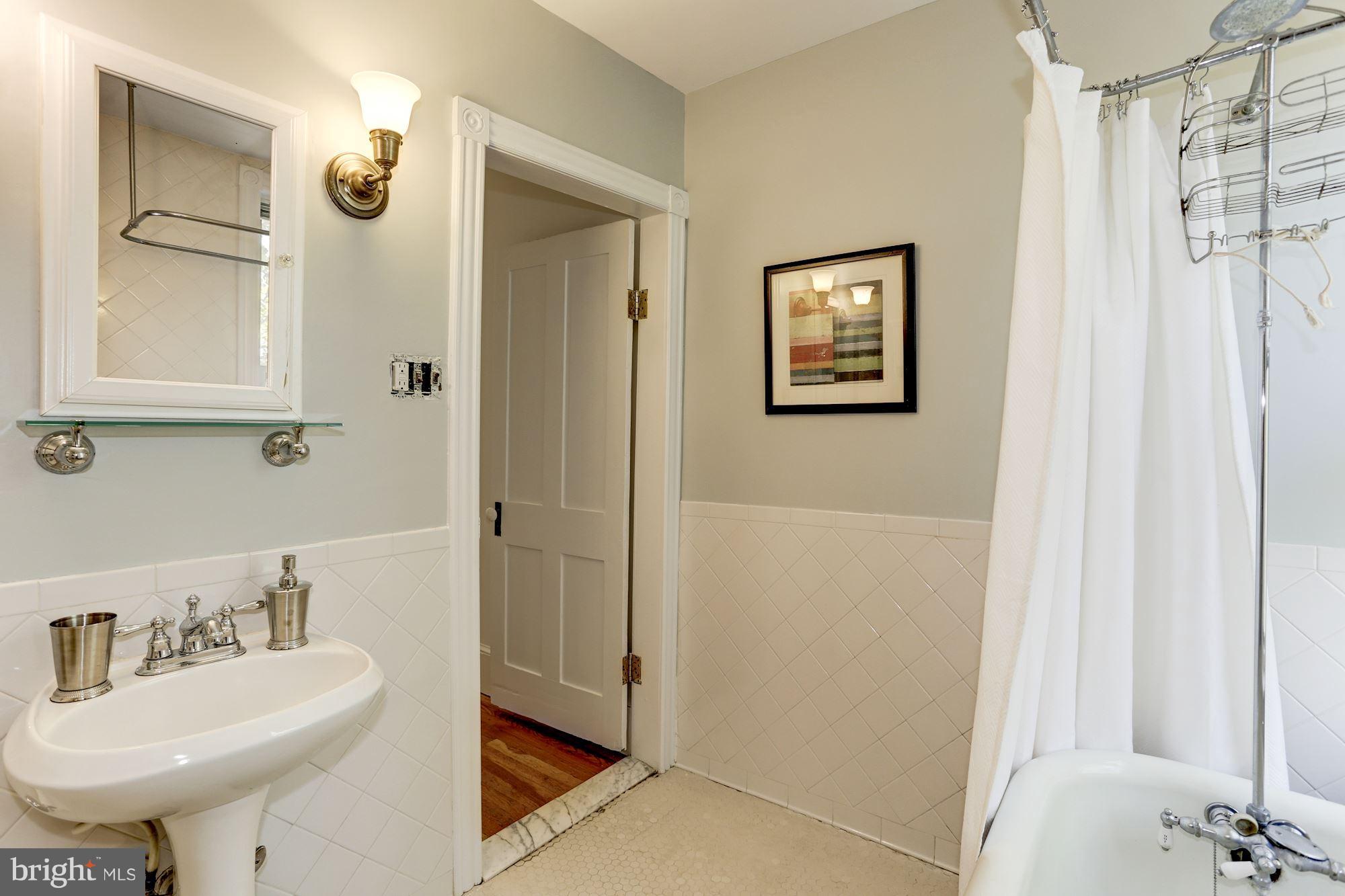 425 5th Street Northeast Washington, DC 20002 - Photo 20 of 21 a bathroom with a sink and a mirror