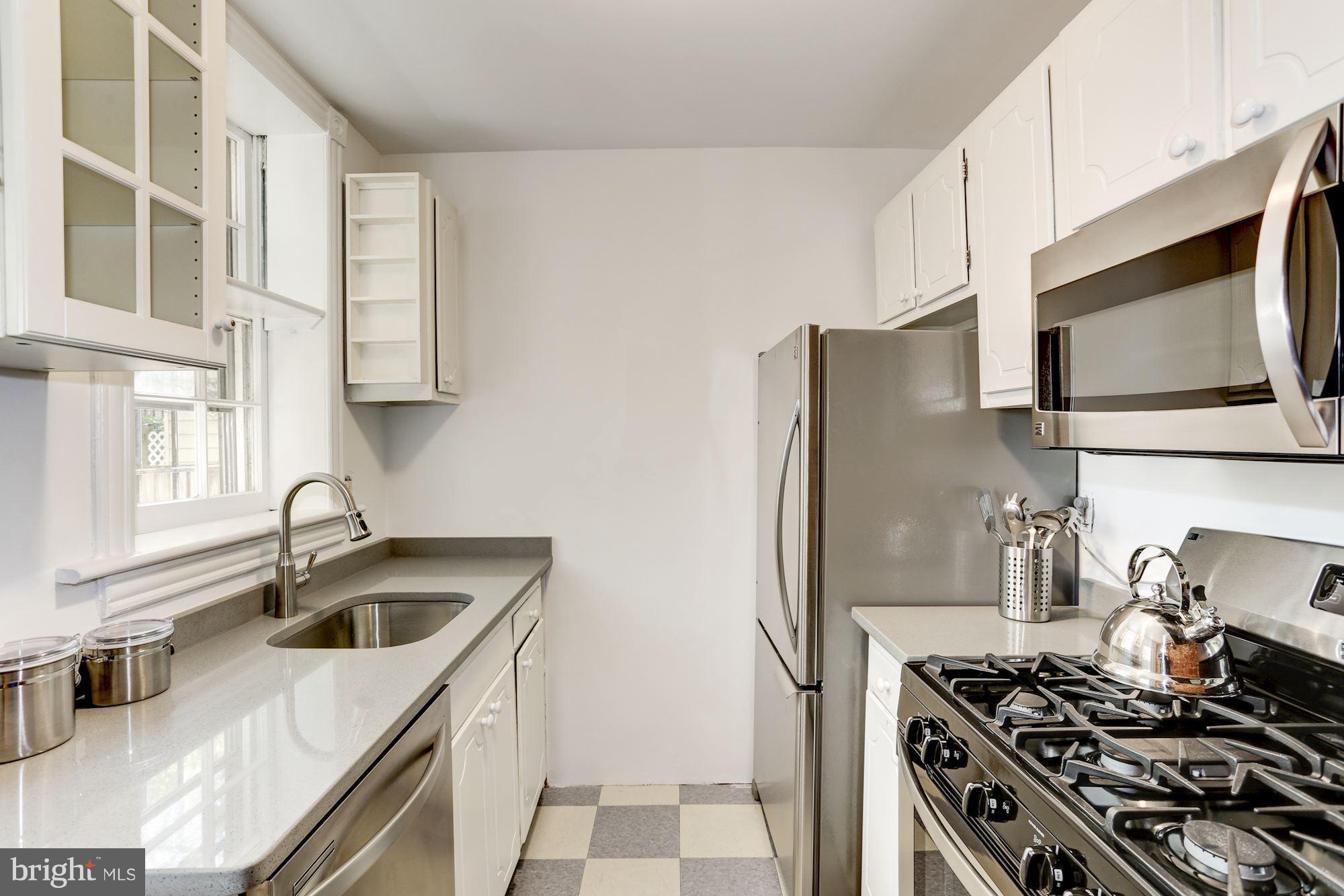 425 5th Street Northeast Washington, DC 20002 - Photo 8 of 21 a kitchen with stainless steel appliances a sink a stove and a refrigerator